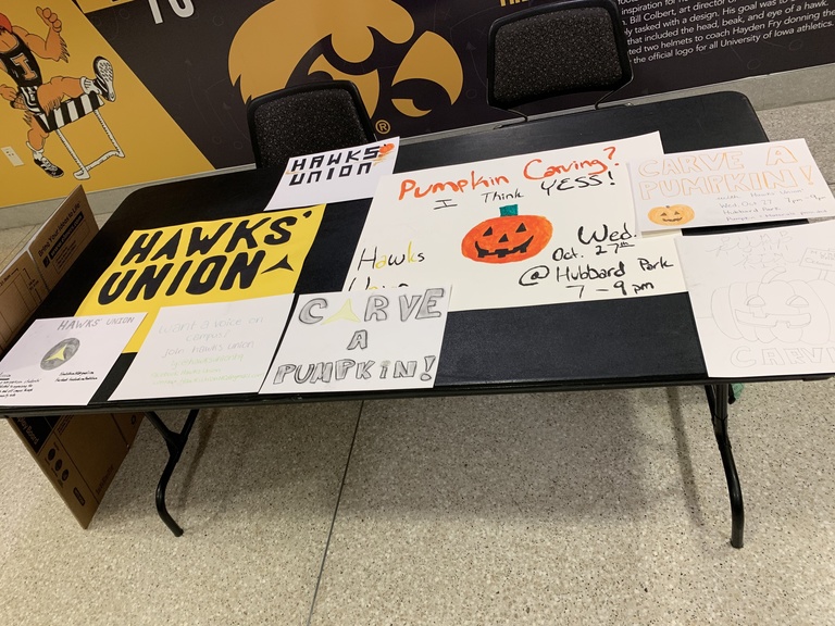 Table with Hawks' Union signs.